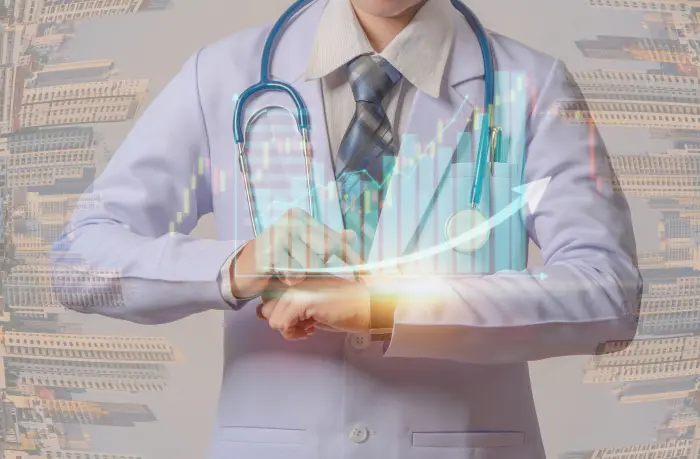 A person in a white coat with a stethoscope around their neck is looking at their wristwatch. In the background, overlayed financial graphs and data charts highlight the role of an efficient Hospital Management System in bridging healthcare and financial growth